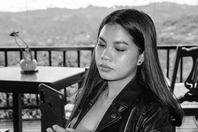 Portrait of woman looking at camera at restaurant