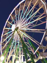 Low angle view of ferris wheel against sky at night