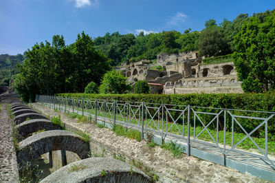 Built structure on landscape against sky