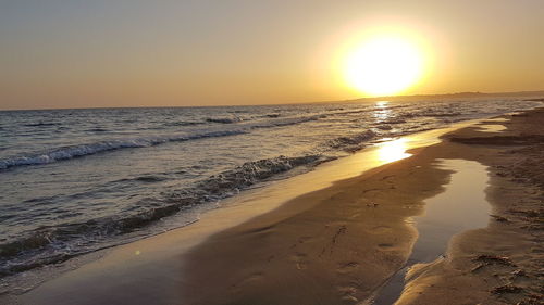 Scenic view of sea against clear sky during sunset