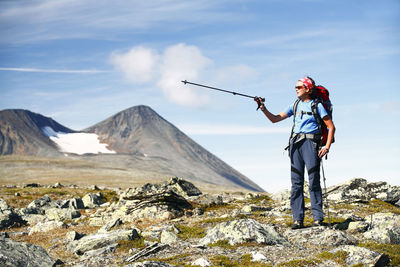 Female hiker with mountain in background