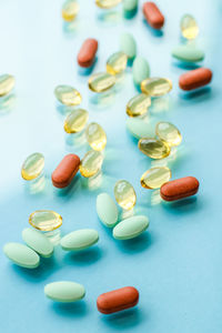 Close-up of pills on yellow background