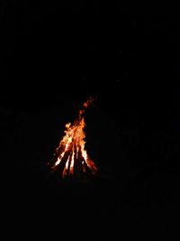Bonfire against clear sky at night