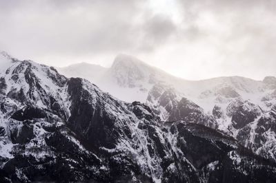 Scenic view of peak mountains against sky