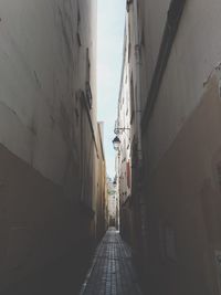 Alley amidst buildings in city