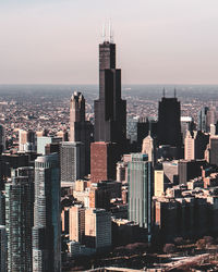 Aerial view of modern buildings in city against sky