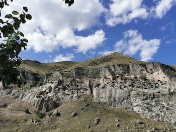 Rock formations on landscape against sky