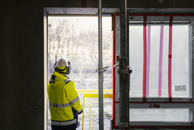 Rear view of engineer at building site