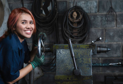 Portrait of a smiling young woman working