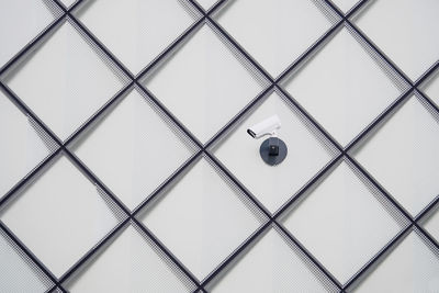 Close-up of security camera on wall