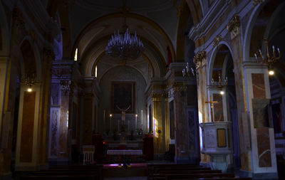 Interior of illuminated cathedral at night