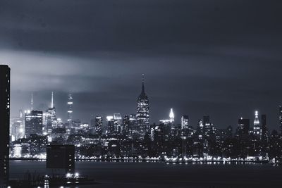 Illuminated buildings in city at night