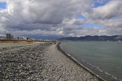 Road by sea against sky