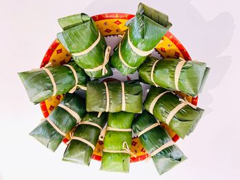 High angle view of chopped leaves against white background