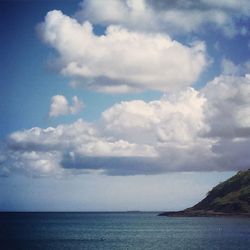 Scenic view of sea against cloudy sky