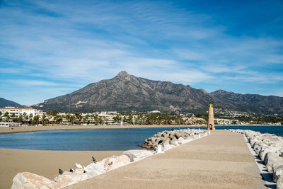 The beaches and mountains surrounding the luxurious port town of puerto banus.