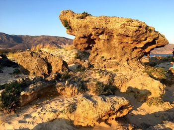 Scenic view of rock formation against clear sky