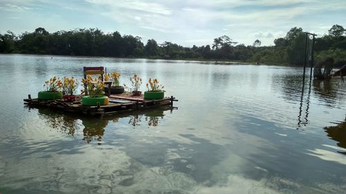 Boat in lake against sky