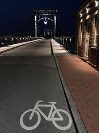 Text on bridge at night