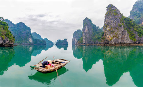 Panoramic view of boats on sea against sky