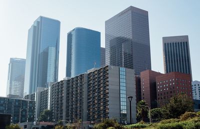 Low angle view of skyscrapers against clear sky