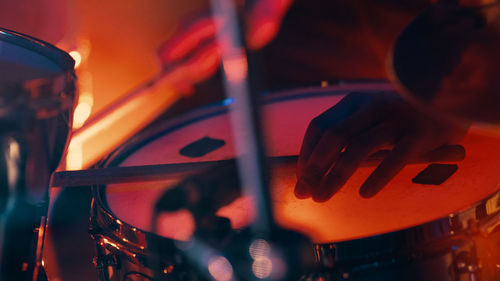 Close-up of hands playing drum