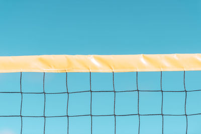 Low angle view of blue umbrella against sky