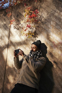 Man photographing using cell phone