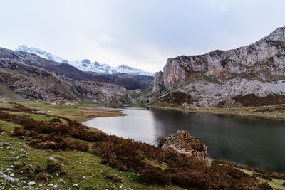 Ercina lake in picos de europe mountains in asturias, spain. scenic lake and mountains against sky