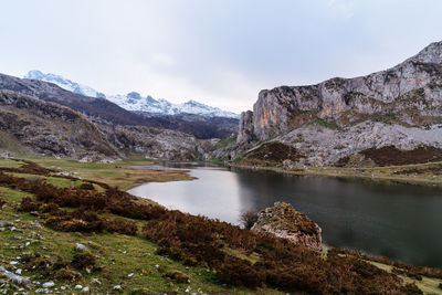Scenic view of lake and mountains against sky