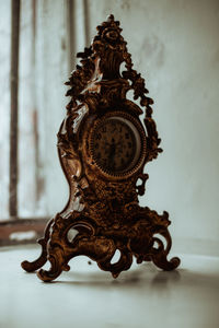 Close-up of clock on wall