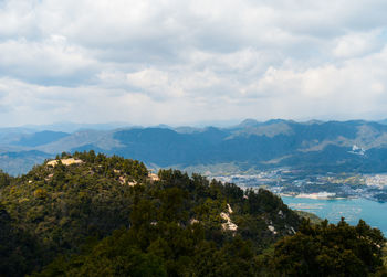 Scenic view of tree mountains against sky