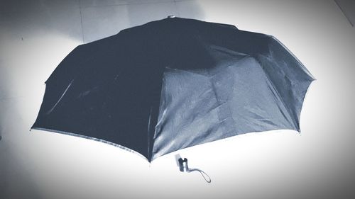 Low angle view of umbrella against white background