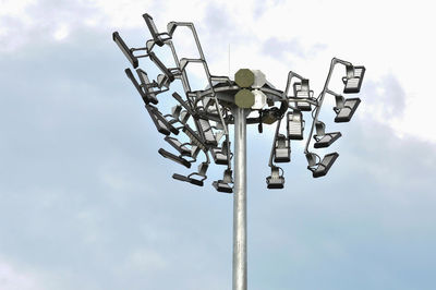 Low angle view of floodlight against sky