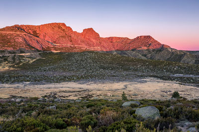 Scenic view of rock formations against sky