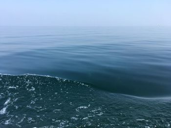 Scenic view of sea against blue sky