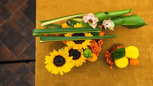 High angle view of yellow flower on floor
