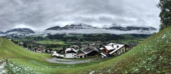 Panoramic view of houses and buildings against sky