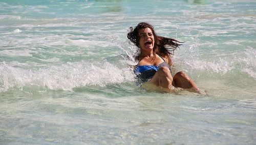 Young woman swimming in sea