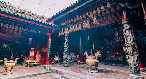 Statue of temple outside building