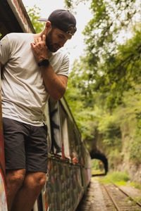 Side view of man standing in park