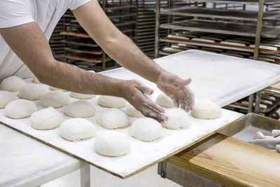 Midsection of man preparing food