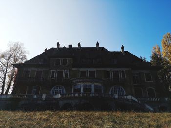 Low angle view of old building against clear sky