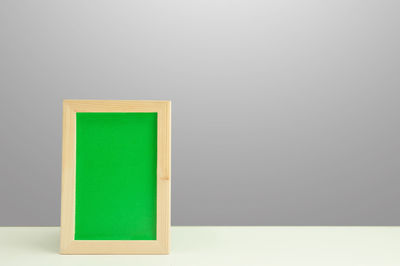 Close-up of empty chair against white background