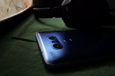 Close-up of mobile phone on table at home