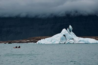 Scenic view of sea against sky during winter