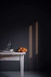 Chestnut on table against wall