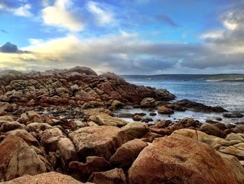 Scenic view of sea against cloudy sky