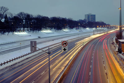 High angle view of light trails on road in city