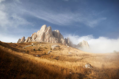 Morning dawn after rain with fog on the alpine of the caucasus mountains. stone castle